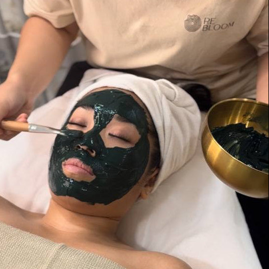 Spirulina detox mask at ReBloom – natural facial treatment applied after massage
